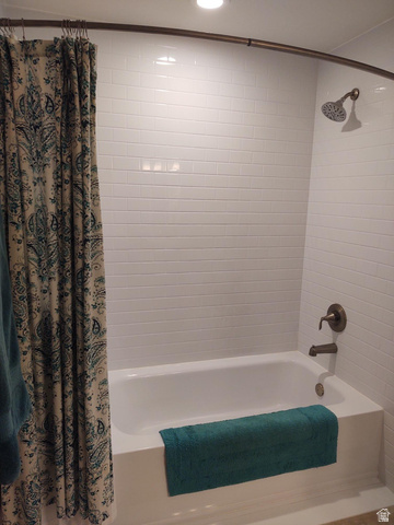 2170 Highway 357 Beaver, UT 84713 - Photo 41 of 56 White subway tile surround, recessed lighting, and bronze-finish fixtures