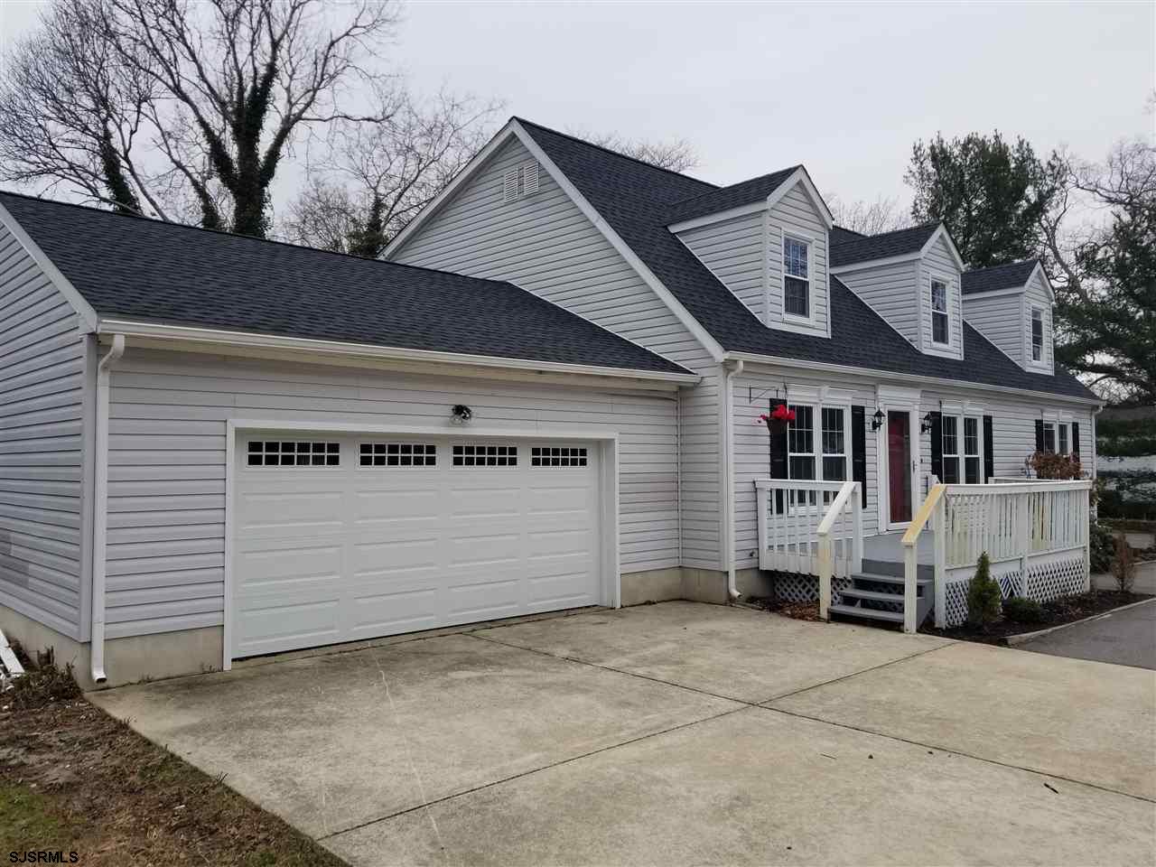 161 East Wyoming Avenue Absecon, NJ 08201 - Photo 2 of 18 a front view of a house with a yard
