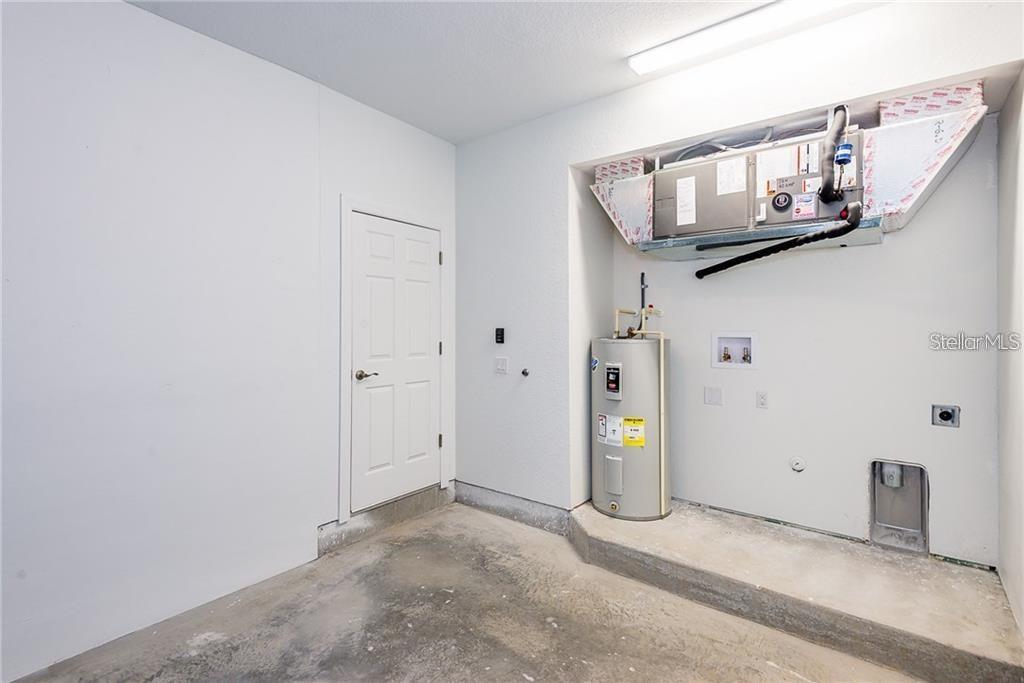 3948 San Rocco Drive, Unit 112 Punta Gorda, FL 33950 - Photo 17 of 18 a view of a hallway with staircase