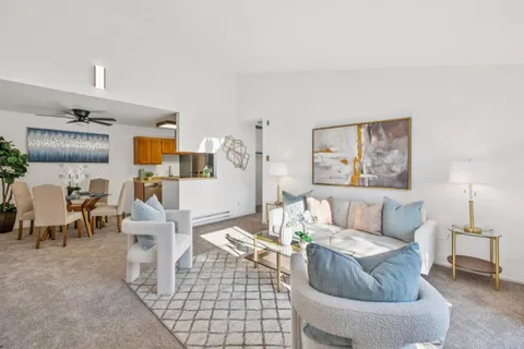 a living room with furniture and a table