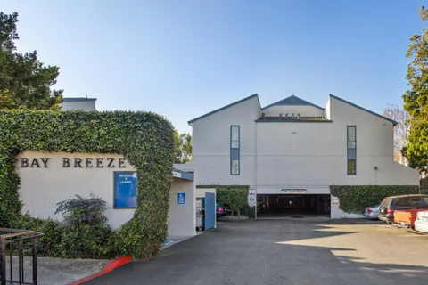 a view of a car park in front of house