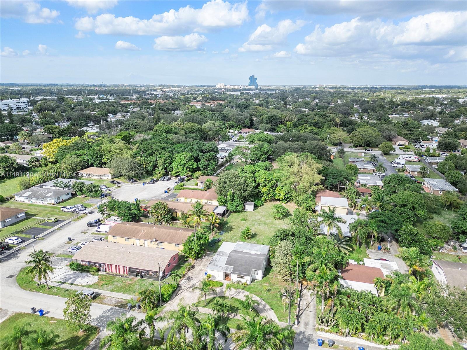 5709 McKinley Street Hollywood, FL 33021 - Photo 12 of 33 an aerial view of residential houses with outdoor space and trees