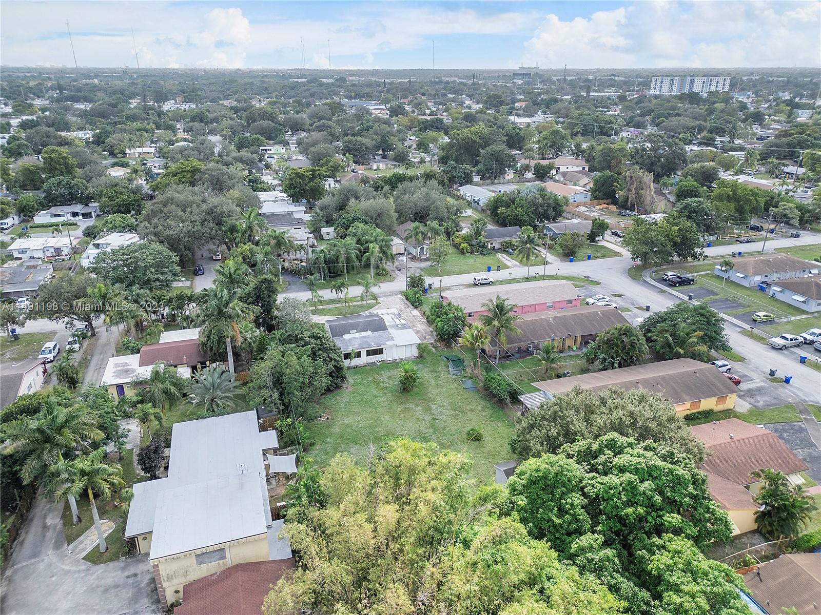 5709 McKinley Street Hollywood, FL 33021 - Photo 23 of 33 an aerial view of residential houses with outdoor space and trees