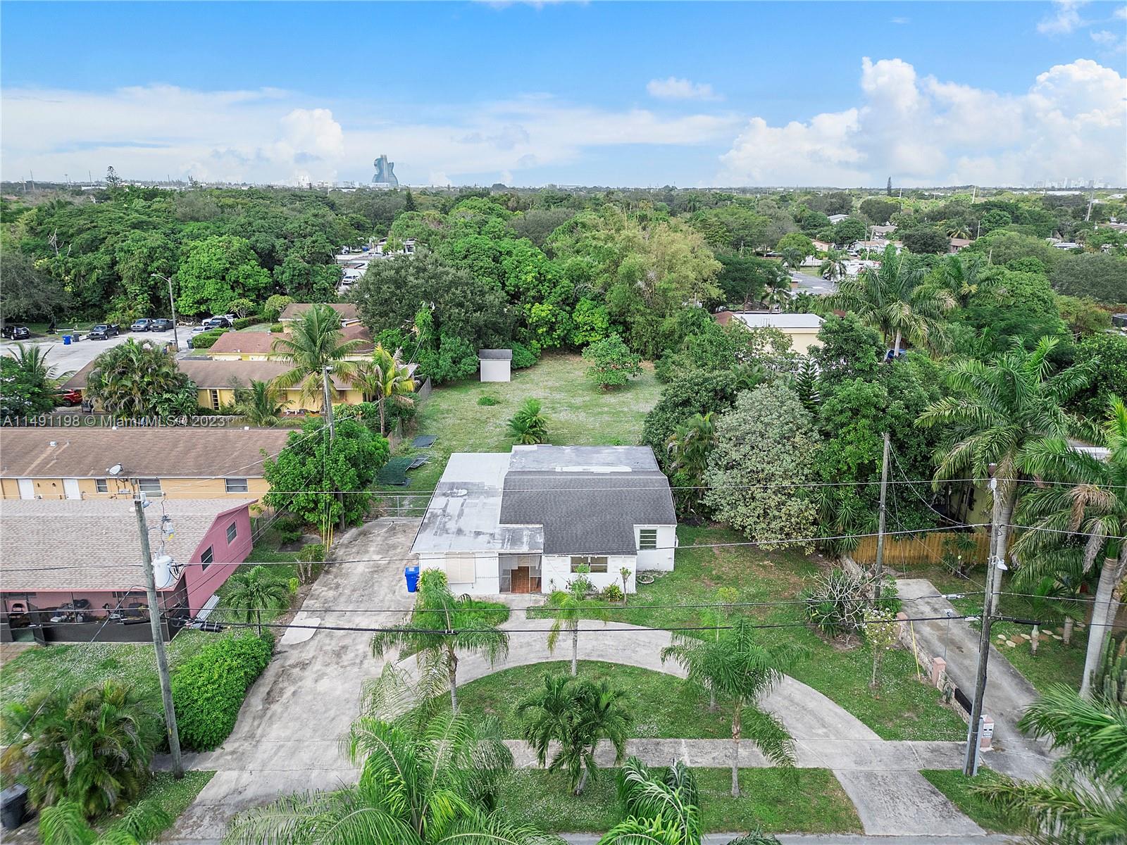 5709 McKinley Street Hollywood, FL 33021 - Photo 10 of 33 an aerial view of a house with yard and green space