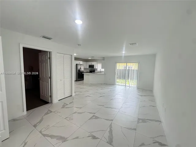 a view of empty room with windows