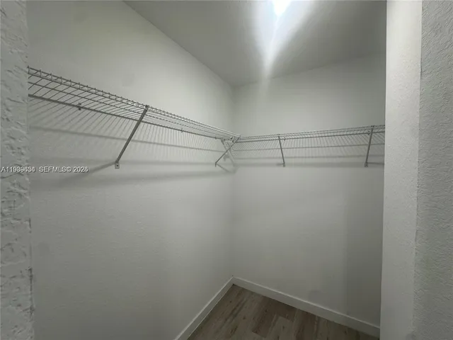 a view of a room with racks on the wall