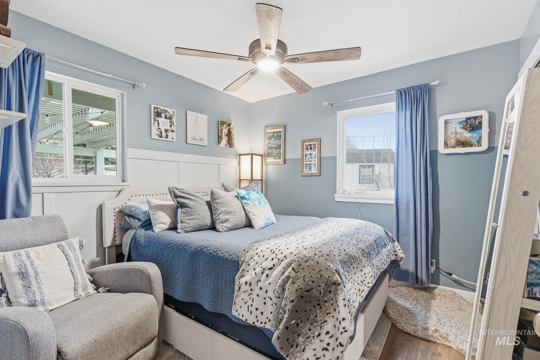4426 West Clark Street Boise, ID 83705 - Photo 19 of 43 Bedroom with wood finished floors, a ceiling fan, and a closet