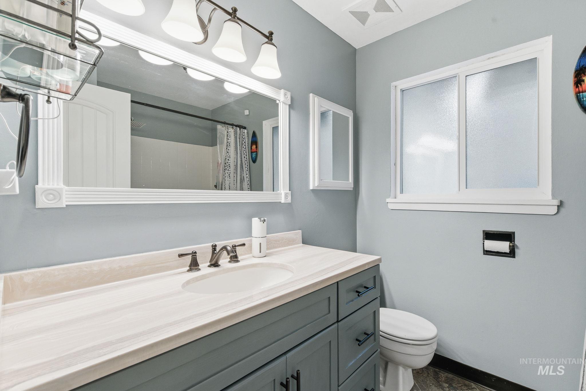 4426 West Clark Street Boise, ID 83705 - Photo 23 of 43 Bathroom featuring vanity and a shower with shower curtain