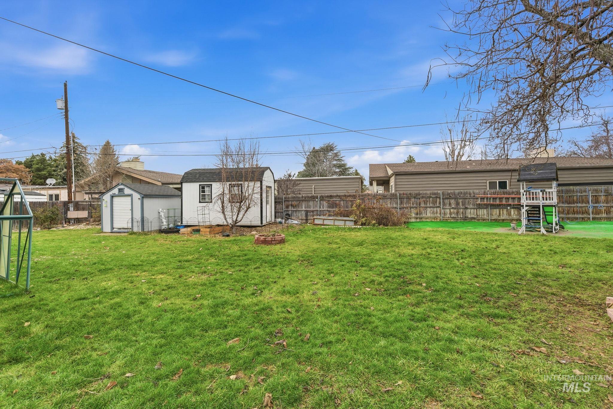 4426 West Clark Street Boise, ID 83705 - Photo 32 of 43 Fenced backyard with a storage shed