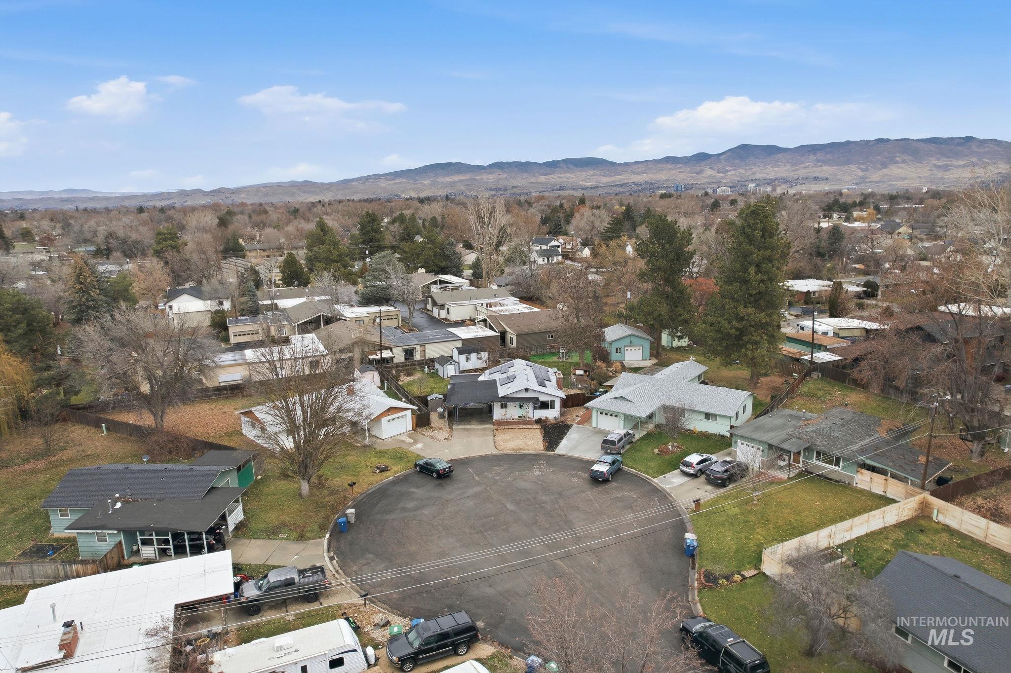 4426 West Clark Street Boise, ID 83705 - Photo 35 of 43 Aerial view of property and surrounding area with nearby suburban area and mountains