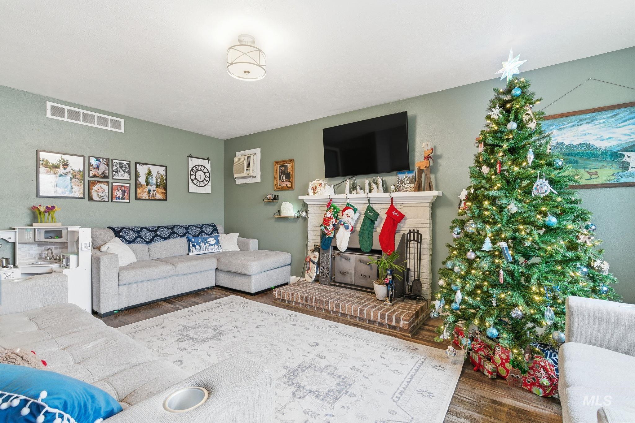 4426 West Clark Street Boise, ID 83705 - Photo 5 of 43 Living area with wood finished floors and a wall mounted AC