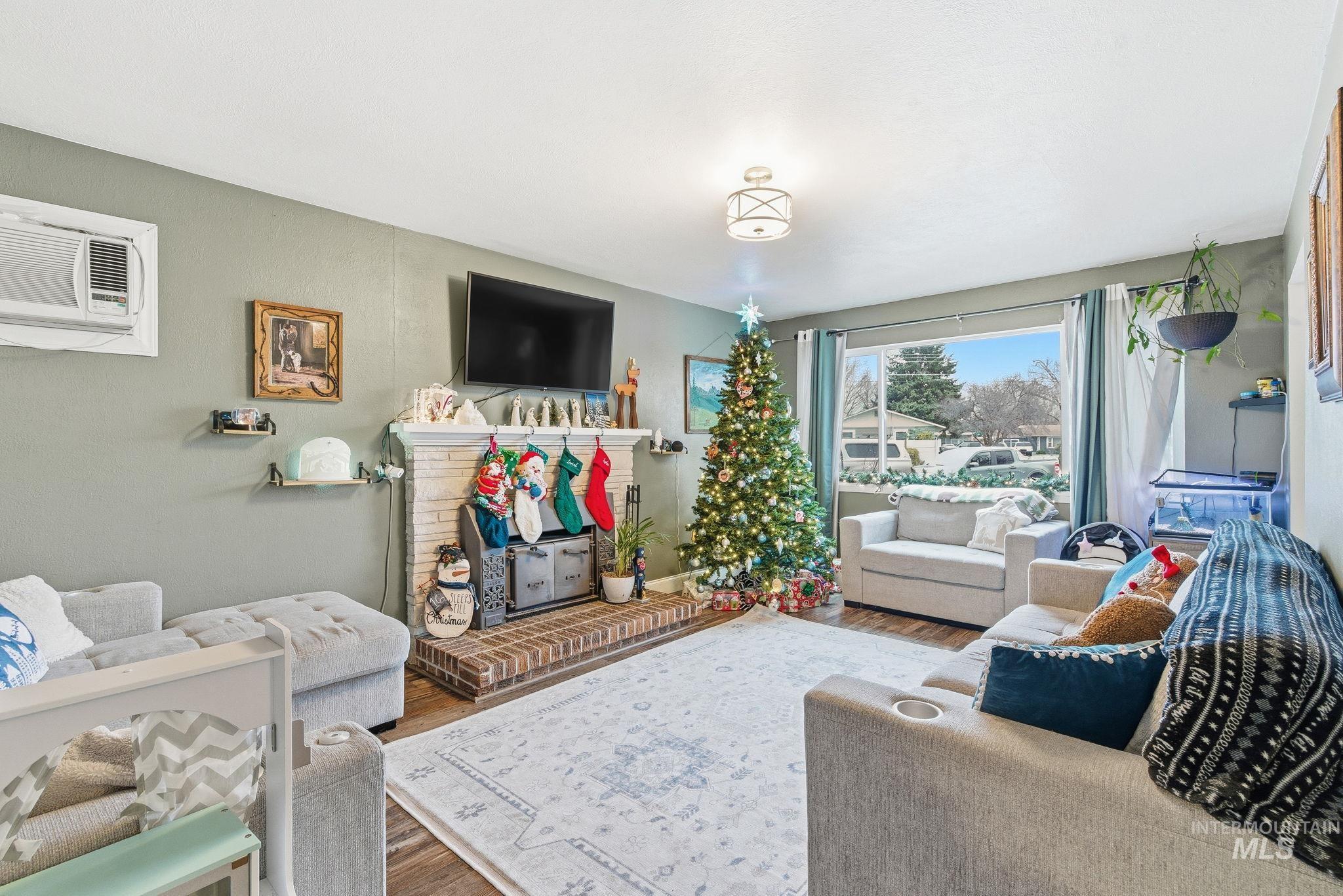 4426 West Clark Street Boise, ID 83705 - Photo 8 of 43 Living room with wood finished floors and a wall mounted AC