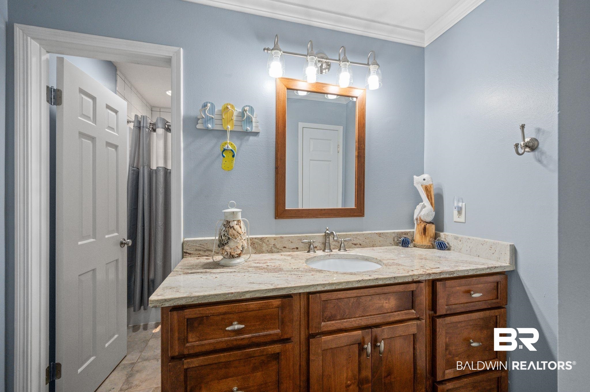20037 County Road 33 Fairhope, AL 36532 - Photo 28 of 79 Bathroom featuring vanity, crown molding, and curtained shower