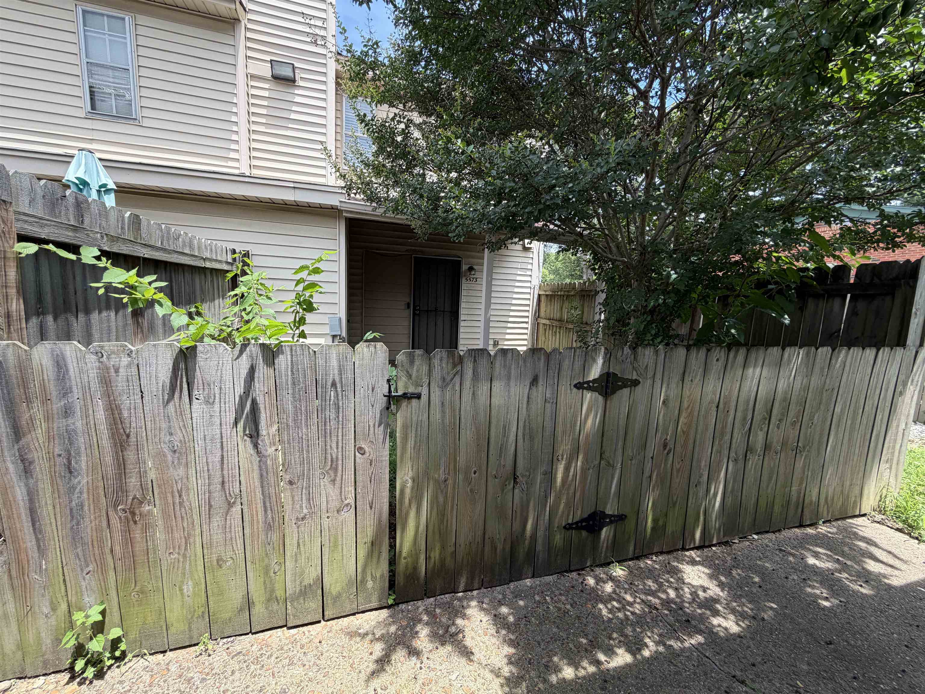5573 Pleasant View Road, Unit 35 Memphis, TN 38134 - Photo 2 of 13 a view of a backyard with a garden