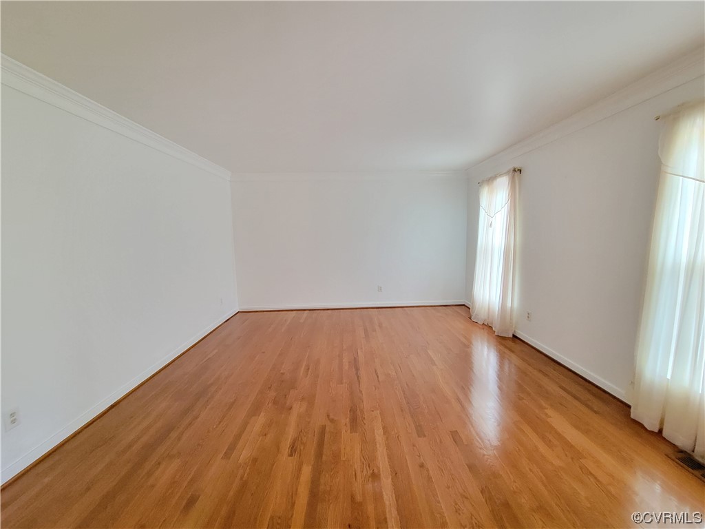 13004 Rockridge Road Chester, VA 23831 - Photo 4 of 38 a view of empty room with wooden floor and fan