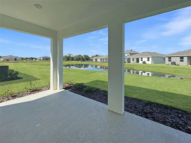 a view of a swimming pool with chairs
