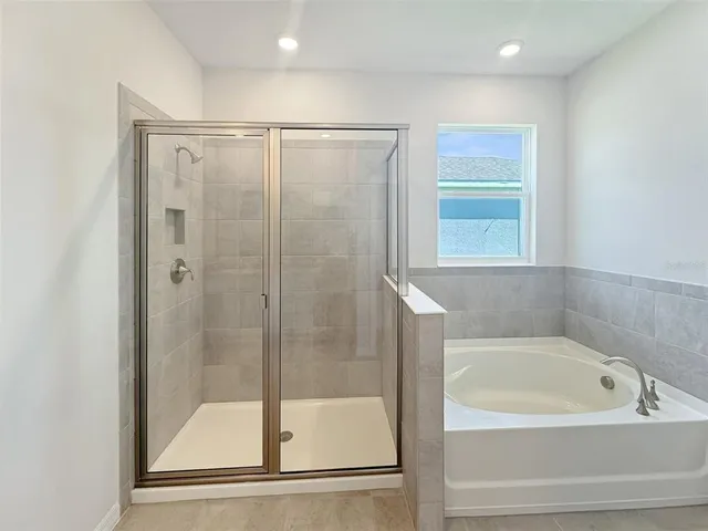 a view of a bathroom from a hallway