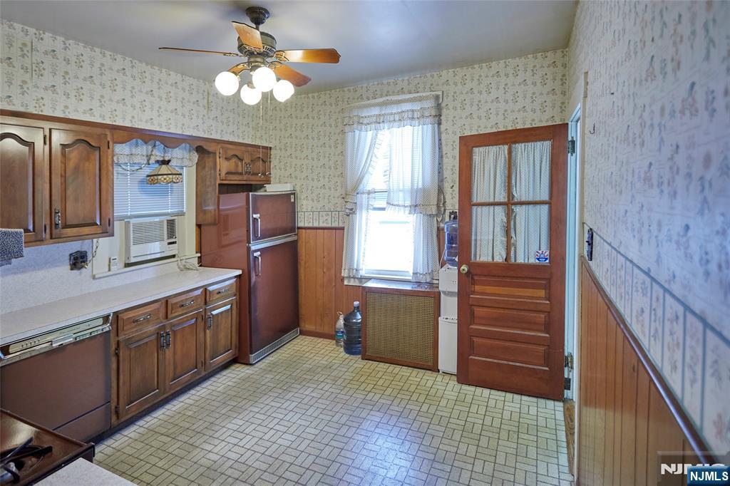 235 Dundee Avenue Paterson, NJ 07503 - Photo 11 of 12 a room with chandelier fan and windows