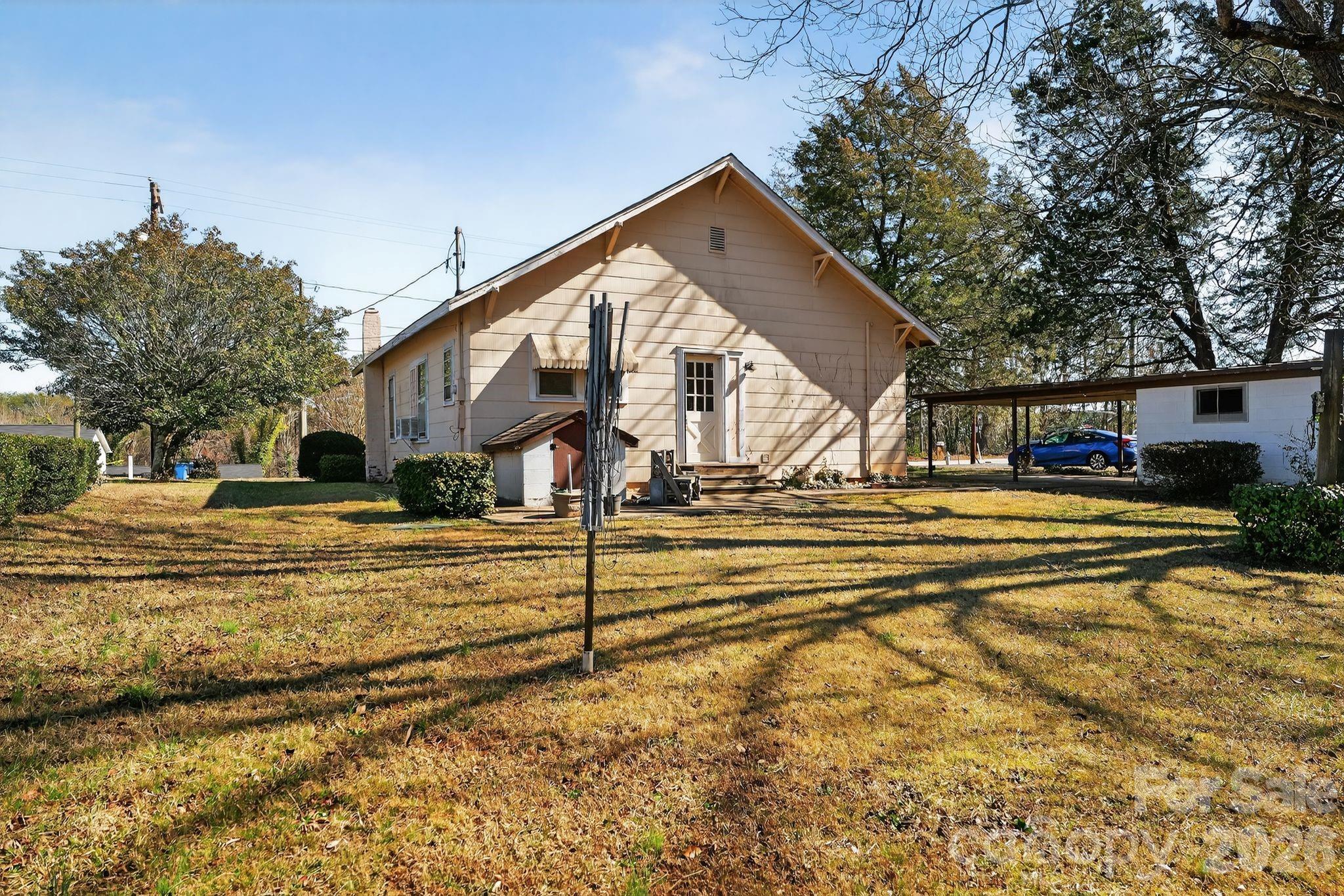 137 Duke Street Granite Falls, NC 28630 - Photo 2 of 16 a view of a house with a yard