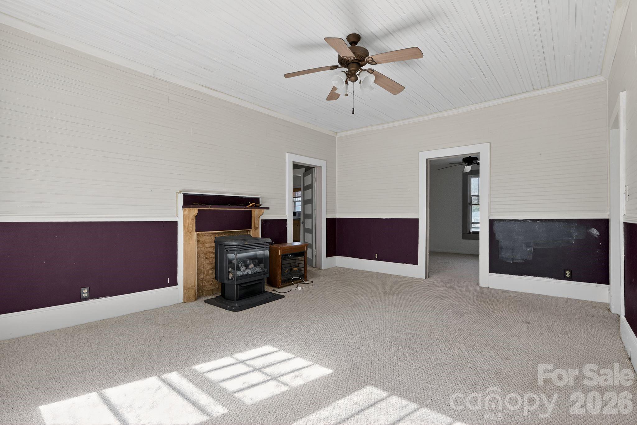 137 Duke Street Granite Falls, NC 28630 - Photo 7 of 16 a living room with furniture and a flat screen tv