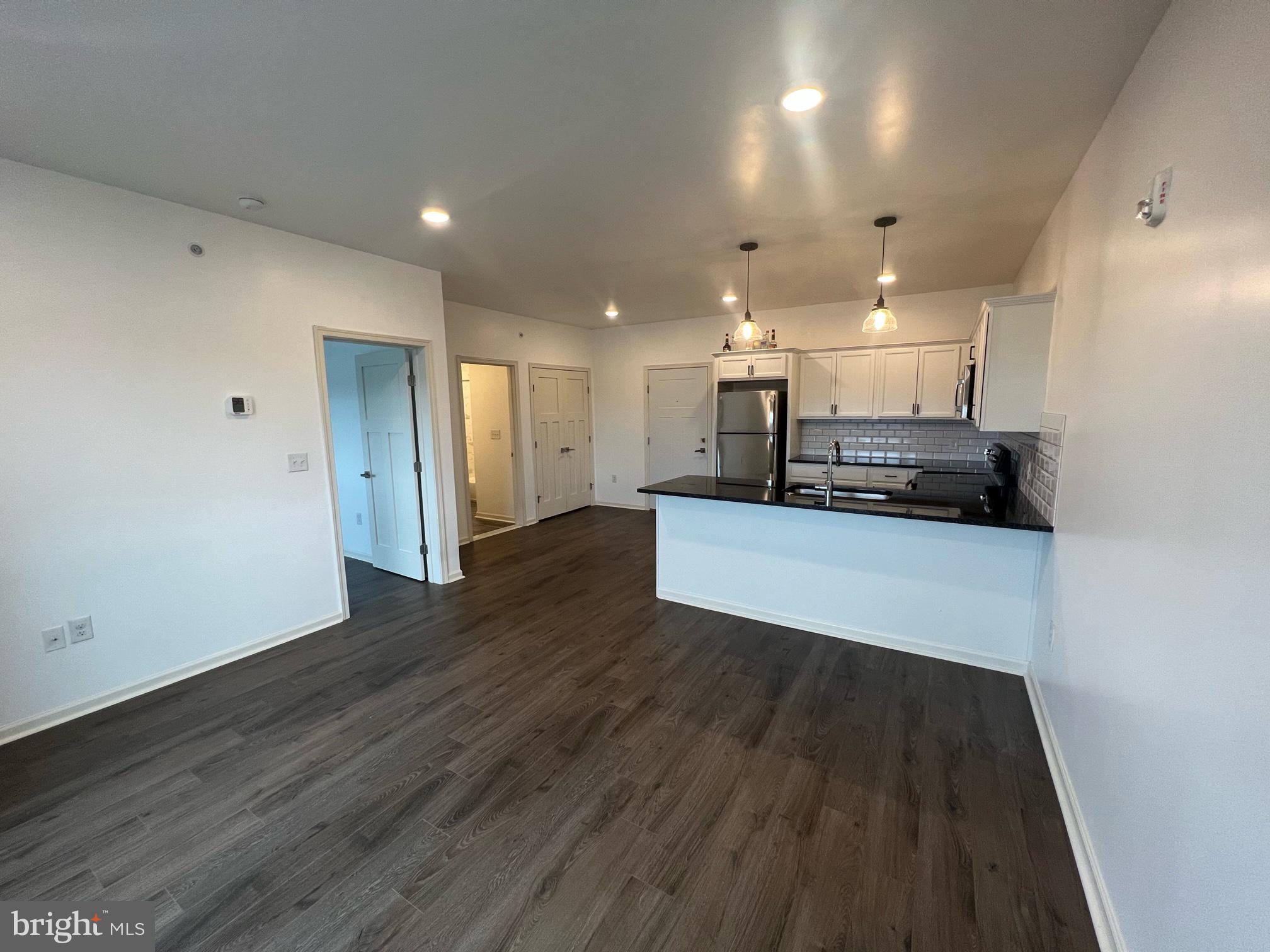 5312 Ridge Avenue, Unit 407 Philadelphia, PA 19128 - Photo 2 of 7 a view of kitchen with refrigerator and microwave