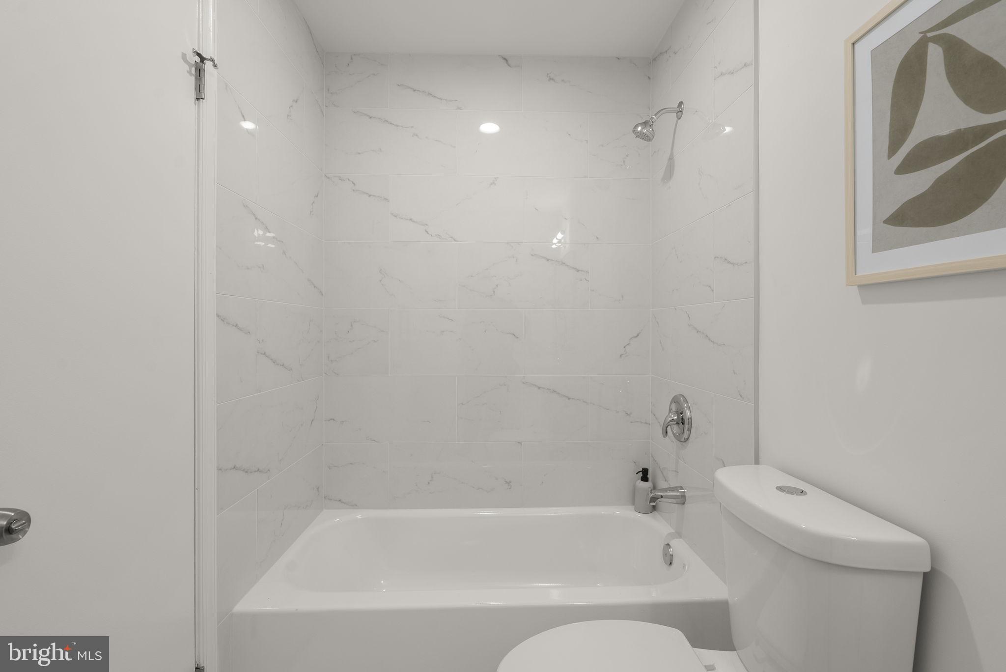 12500 Parkton Street Fort Washington, MD 20744 - Photo 17 of 29 Full bath with tub and clean modern finishes