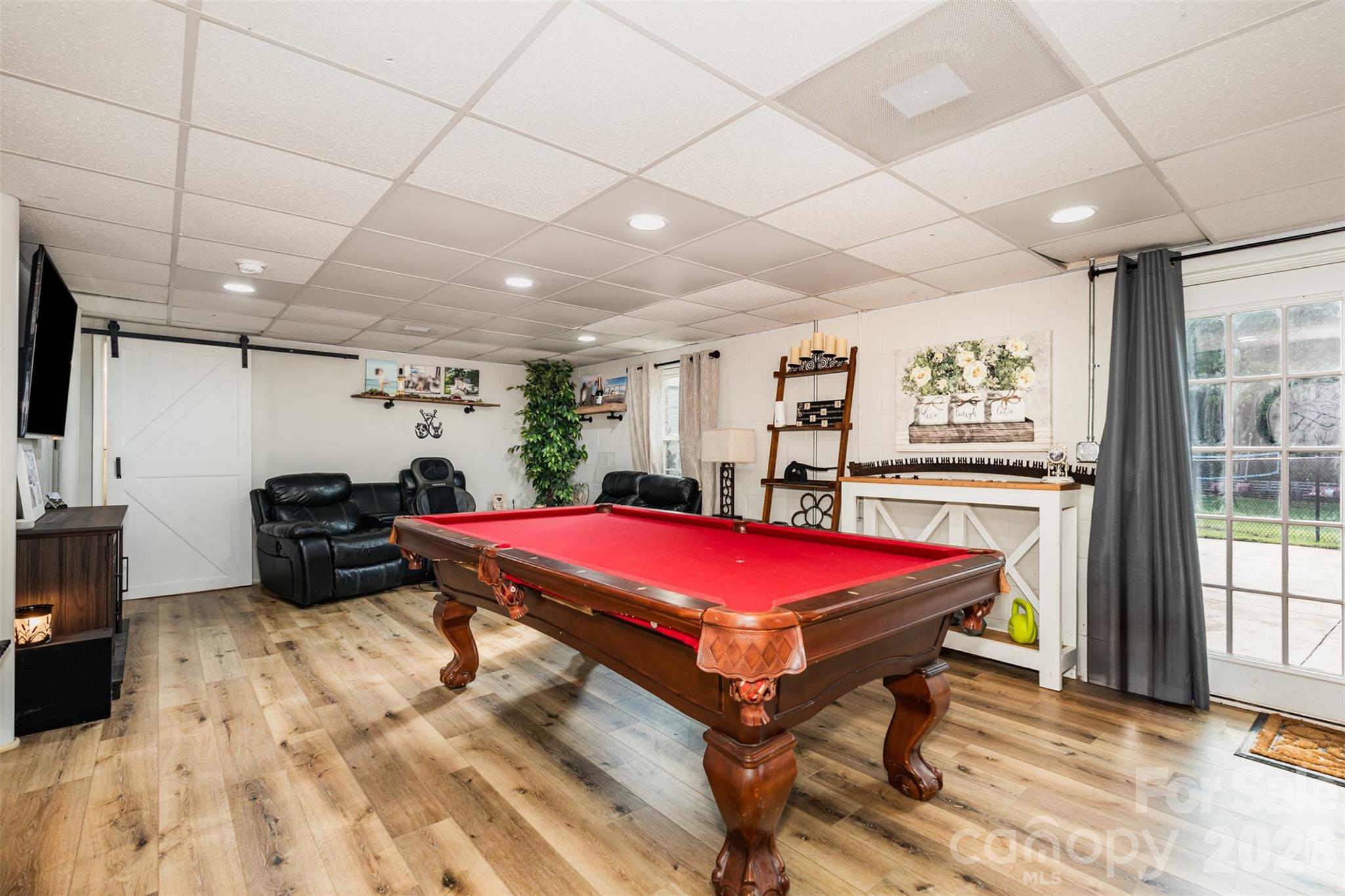 197 Sain Road Statesville, NC 28625 - Photo 25 of 44 a living room with furniture pool table and flat screen tv