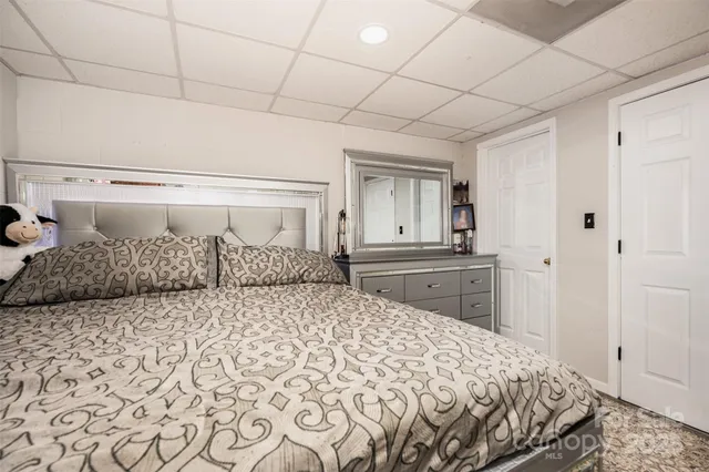 a living room with fireplace furniture and a flat screen tv