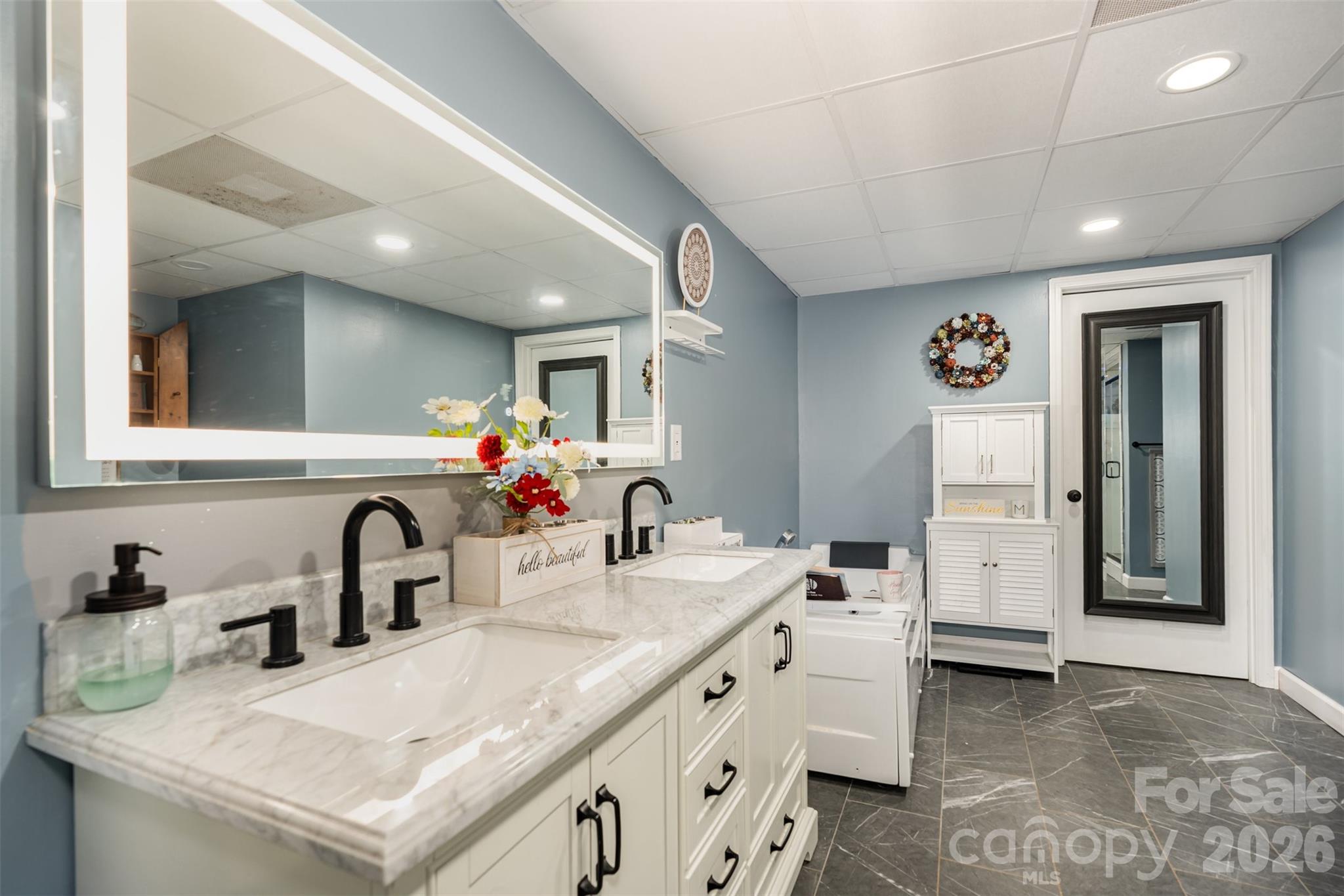 197 Sain Road Statesville, NC 28625 - Photo 29 of 44 a bathroom with a sink and a mirror