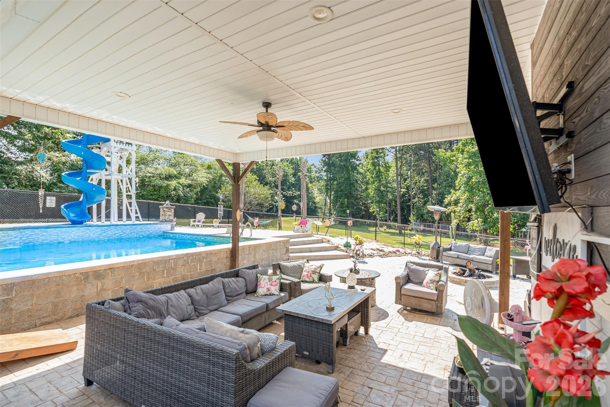 197 Sain Road Statesville, NC 28625 - Photo 35 of 44 a living room with furniture and a floor to ceiling window