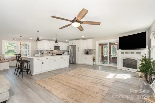 a view of a kitchen with workspace and a fireplace