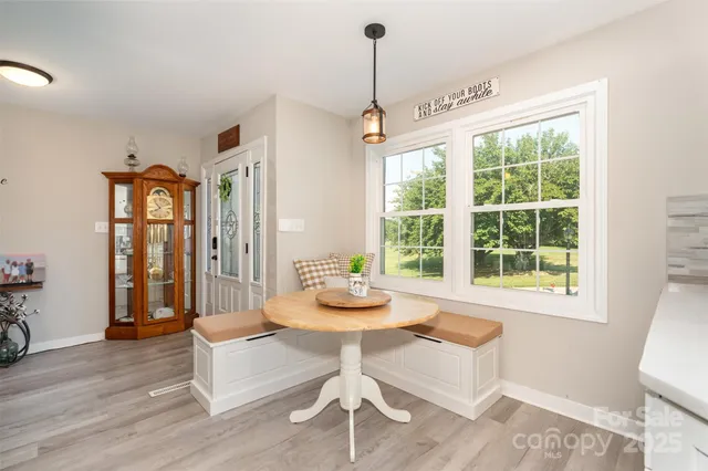 a kitchen with a table and chairs
