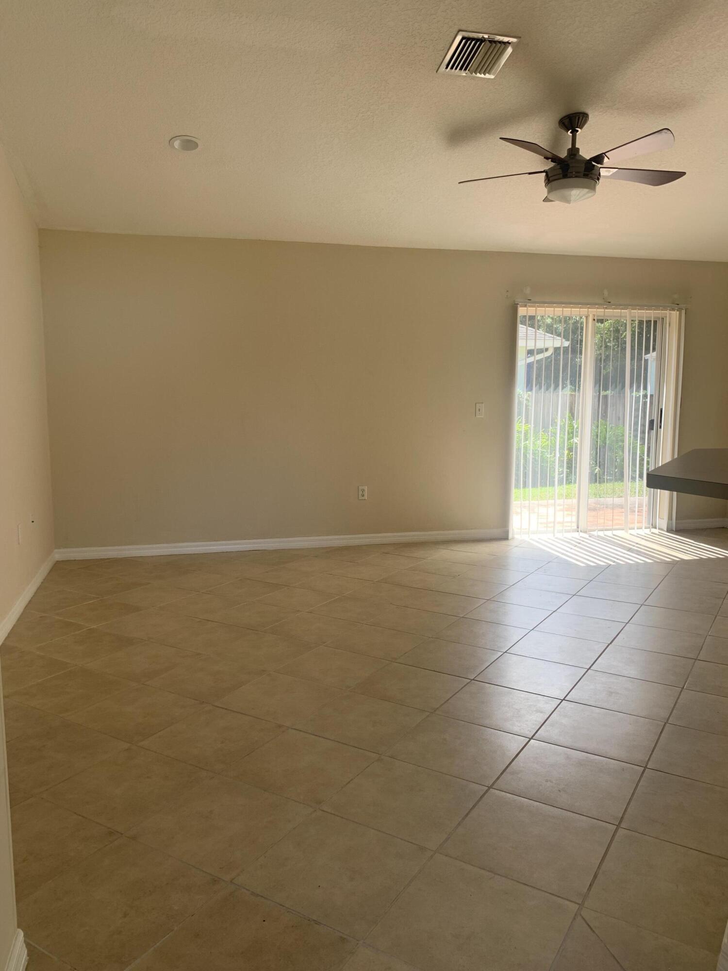 3409 12th Street Southwest Vero Beach, FL 32968 - Photo 11 of 26 a view of an empty room with a window