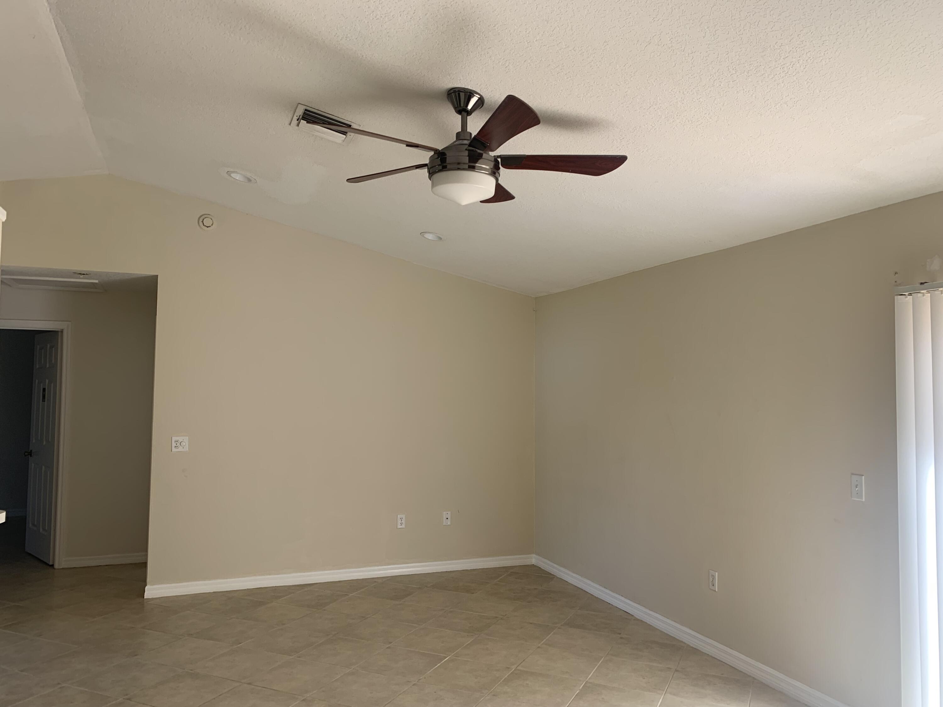 3409 12th Street Southwest Vero Beach, FL 32968 - Photo 17 of 26 a view of a room with rack on the wall