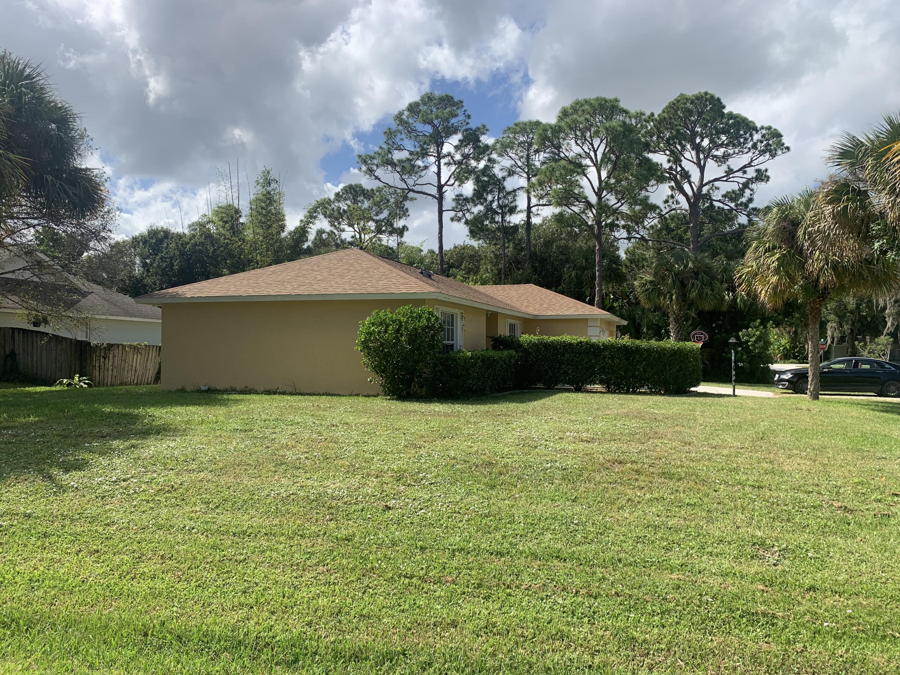 3409 12th Street Southwest Vero Beach, FL 32968 - Photo 3 of 26 a view of a house with a backyard