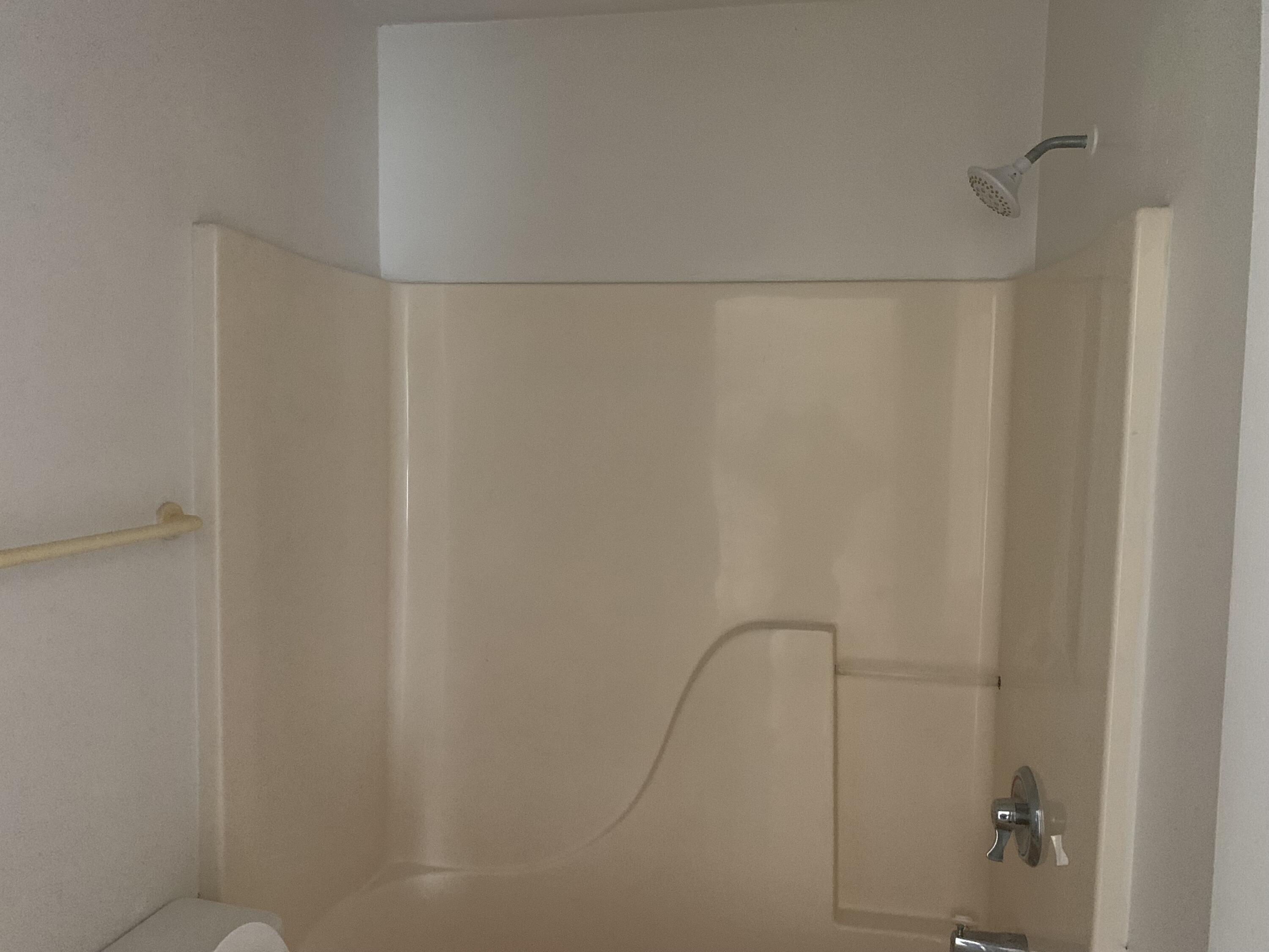 3409 12th Street Southwest Vero Beach, FL 32968 - Photo 23 of 26 a bathroom with a glass shower door