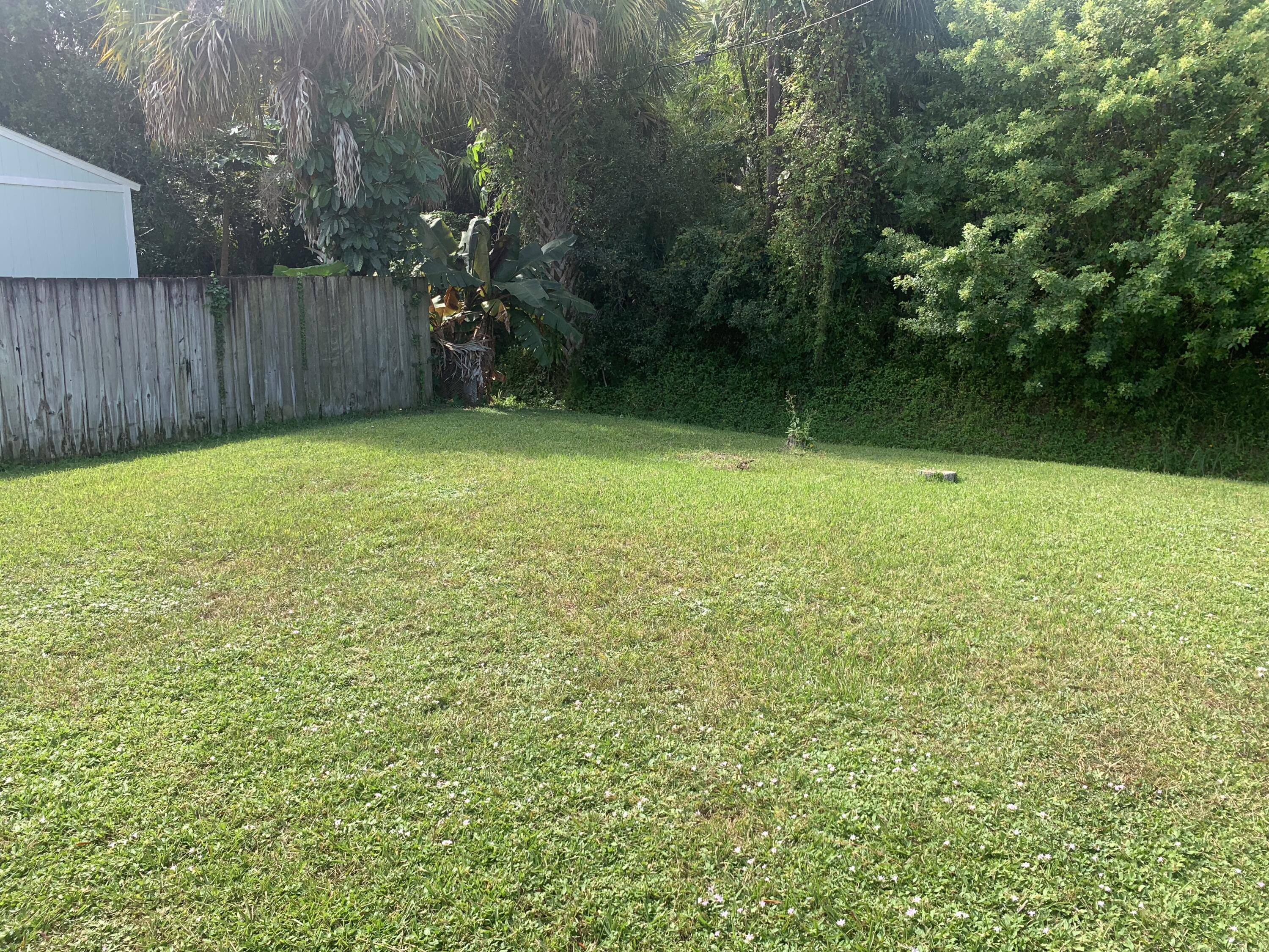 3409 12th Street Southwest Vero Beach, FL 32968 - Photo 26 of 26 a view of a yard with a trees