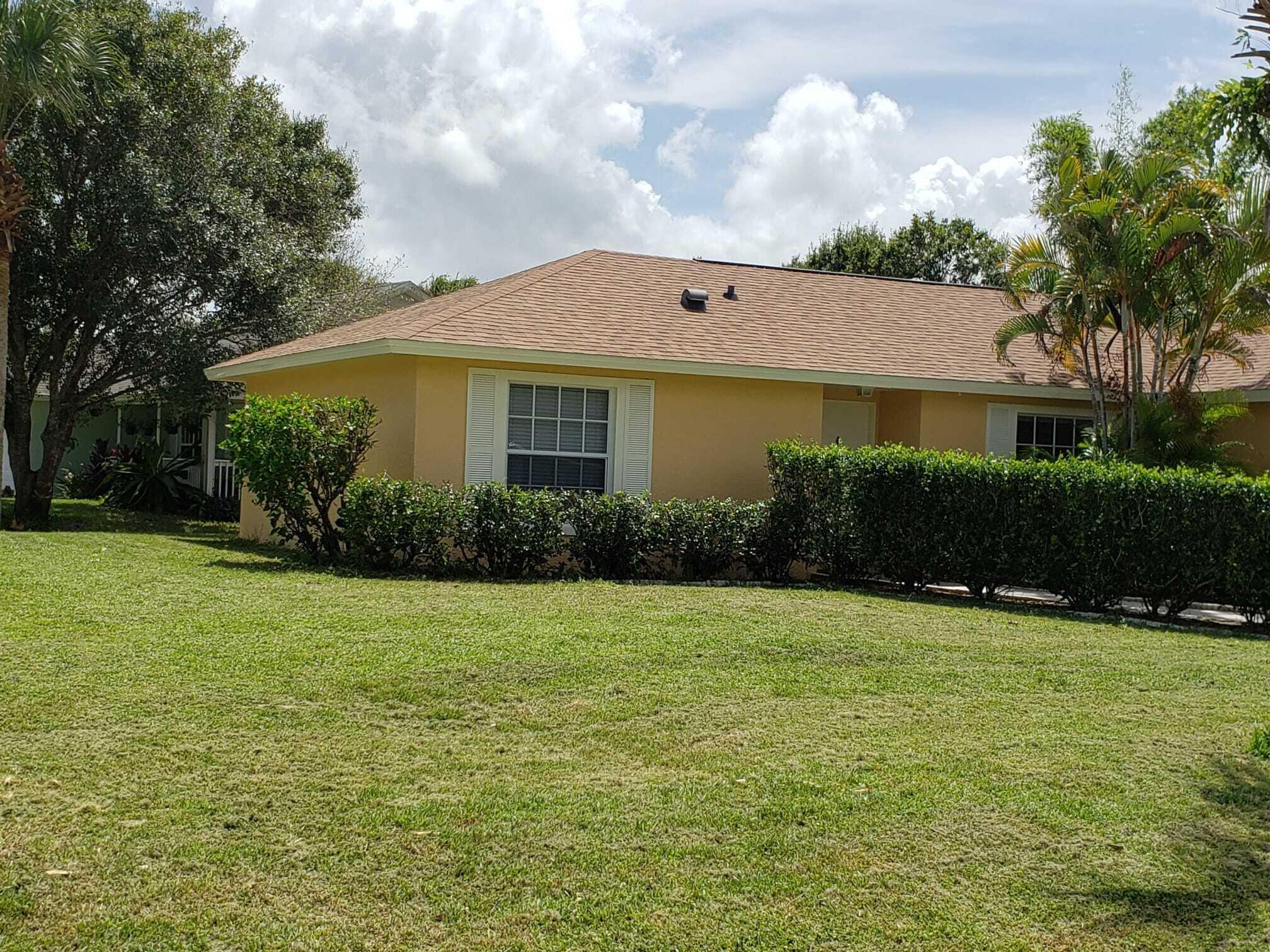 3409 12th Street Southwest Vero Beach, FL 32968 - Photo 4 of 26 a front view of a house with garden