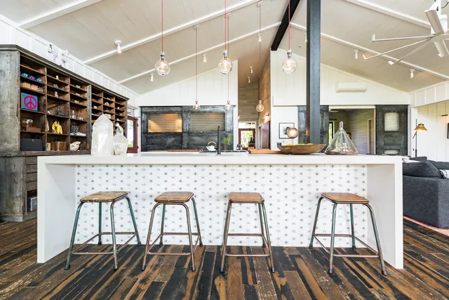 a room with lots of books and furniture
