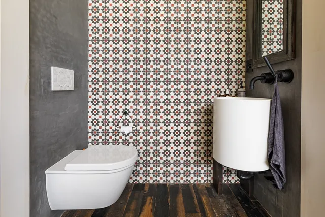 a living room with furniture and a ceiling fan