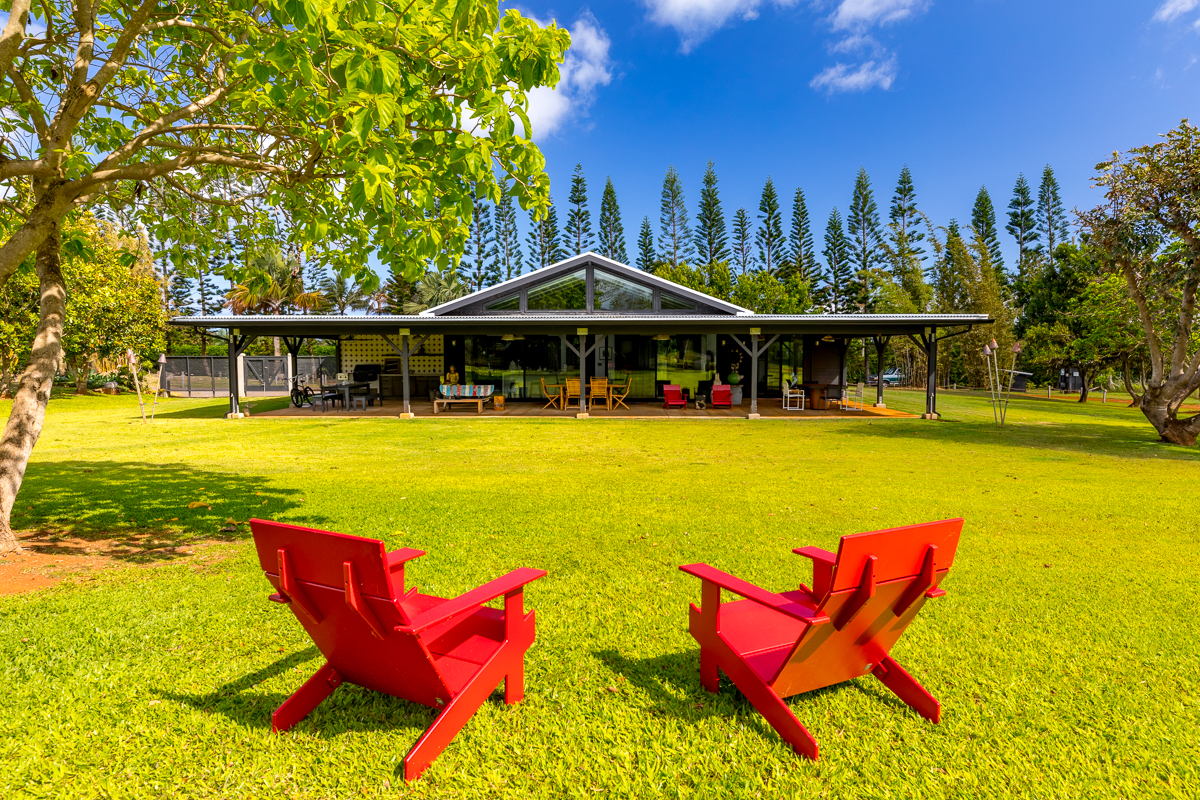 2671 Kauapea Road Kilauea, HI 96754 - Photo 28 of 30 a view of a swimming pool with lawn chairs under an umbrella