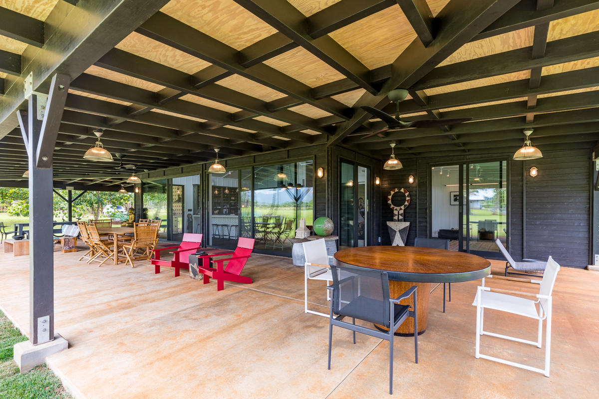 2671 Kauapea Road Kilauea, HI 96754 - Photo 3 of 30 a view of a dinning table and chairs in the patio