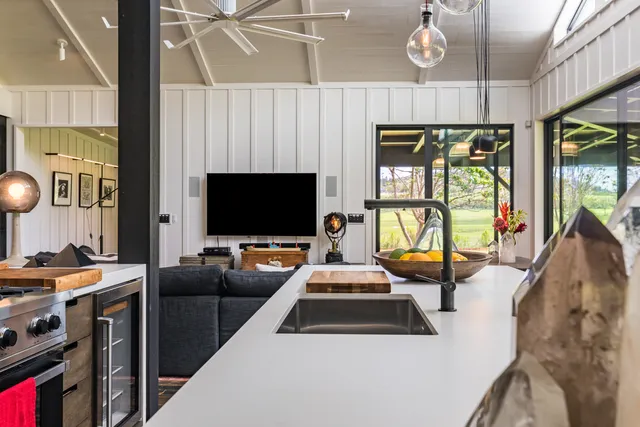 a kitchen with stainless steel appliances a sink and a stove