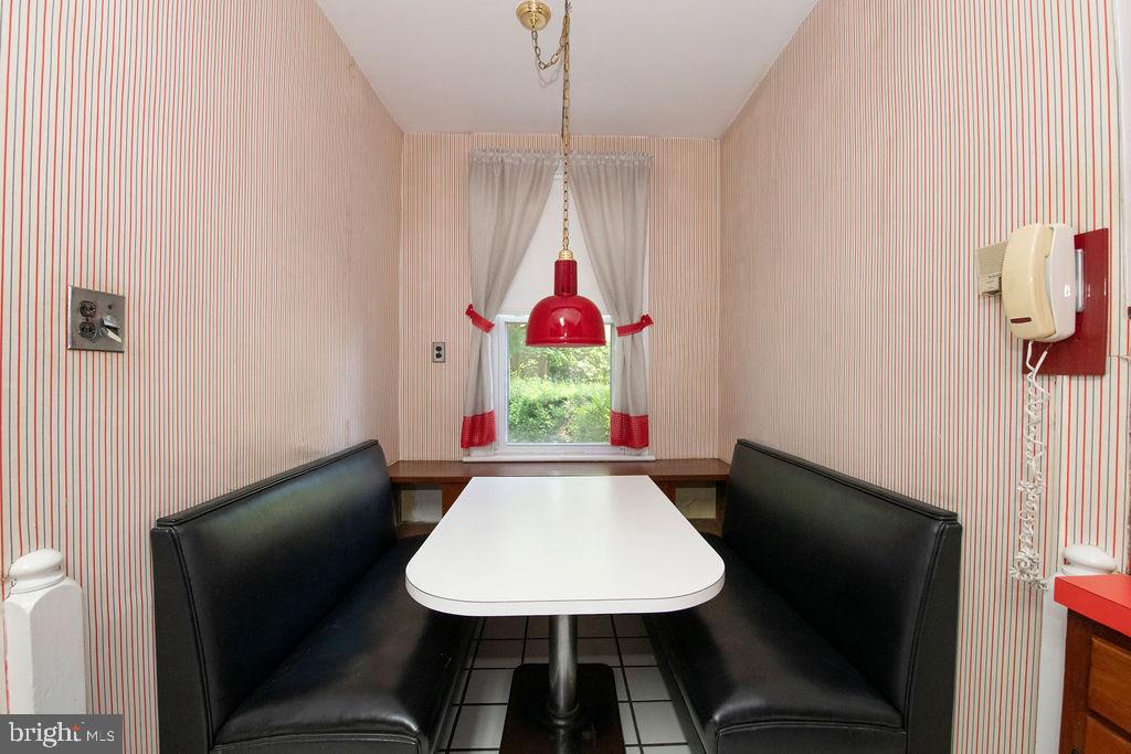 103 Waverly Road Wyncote, PA 19095 - Photo 13 of 41 a view of a dining room with furniture and wooden floor