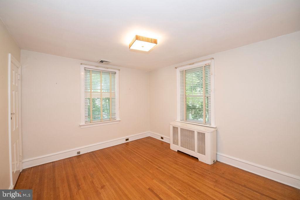 103 Waverly Road Wyncote, PA 19095 - Photo 23 of 41 an empty room with wooden floor and windows