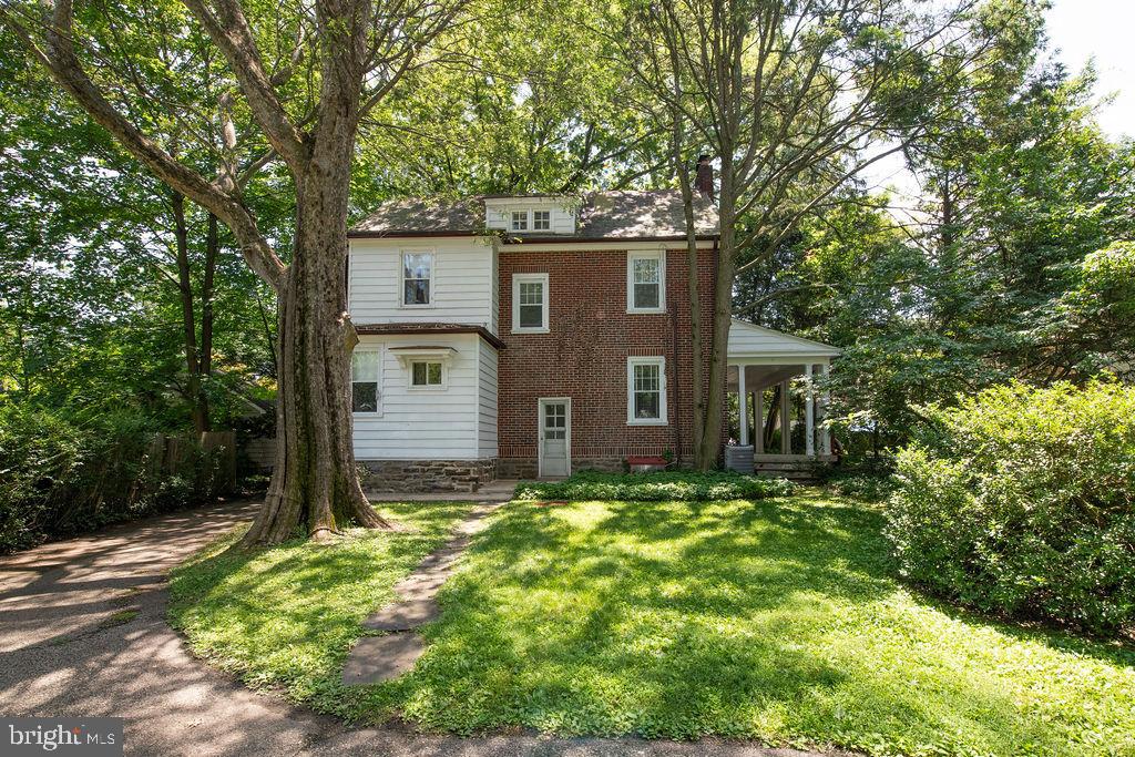 103 Waverly Road Wyncote, PA 19095 - Photo 38 of 41 a view of a house with a large tree and a yard