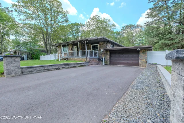 a house with trees in the background