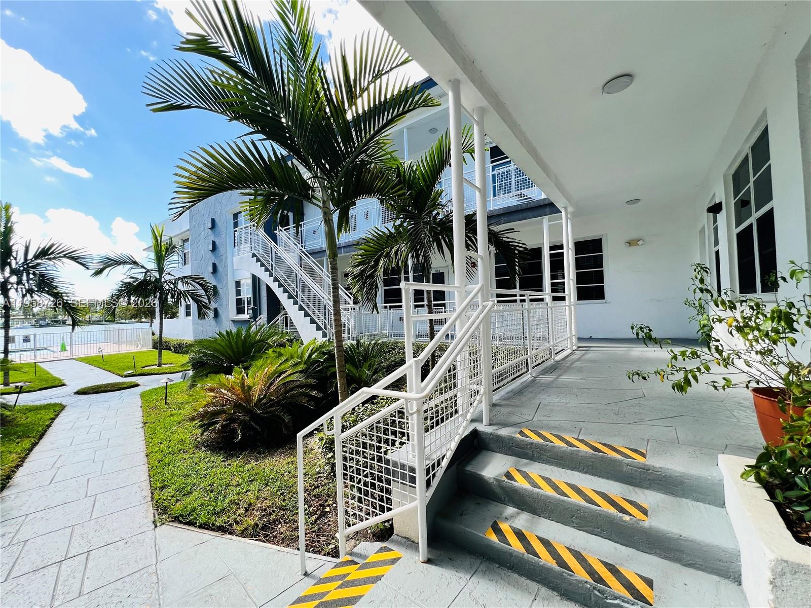 960 Bay Drive, Unit 902 Miami Beach, FL 33141 - Photo 22 of 25 a view of a house with backyard and swimming pool