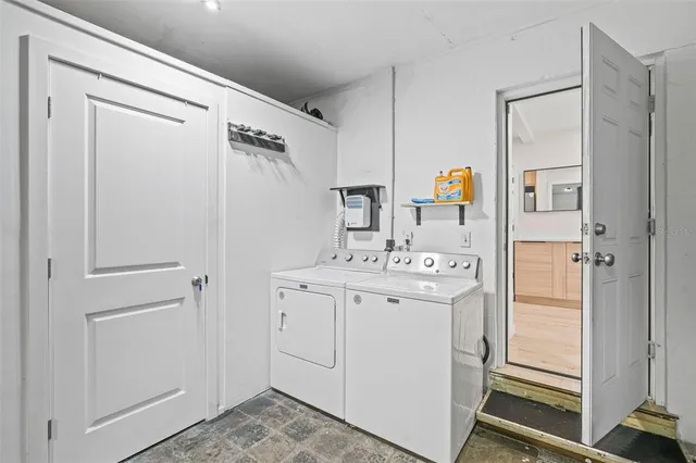 a view of bathroom with a sink and mirror