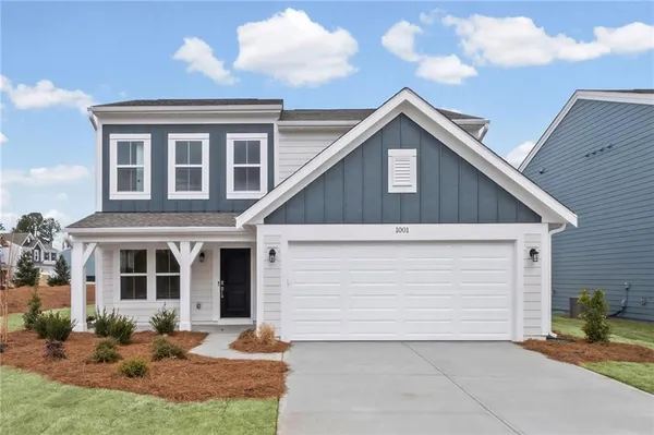an aerial view of a house with a big yard